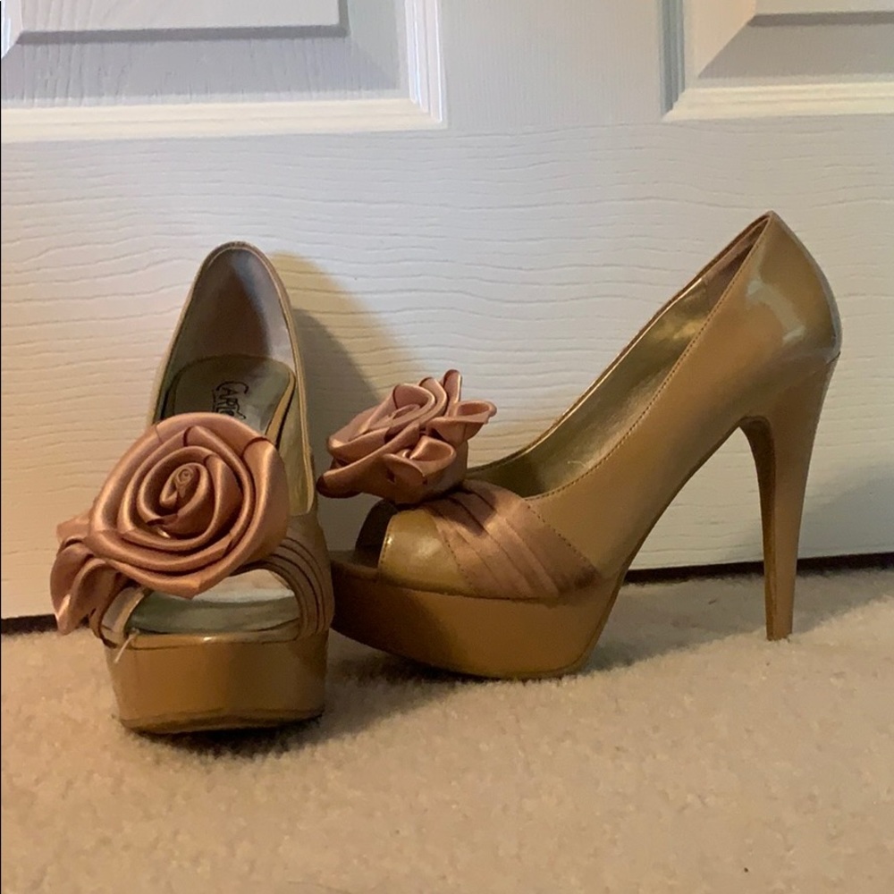 Tan heels with a satin rose on the front